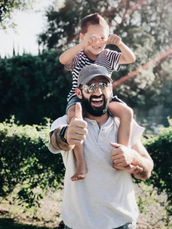 man carrying children